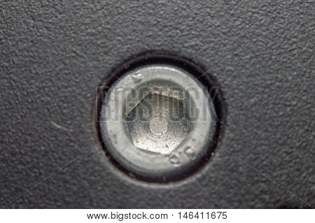 Macro of Screw head in metal plate
