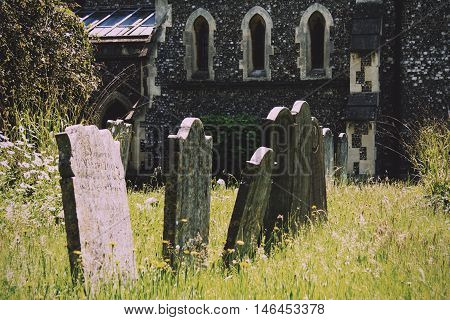 Grave Stones Outside A Church In Beaconsfield, Buckinghamshire, England Vintage Retro Filter.