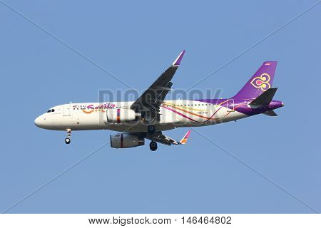 CHIANGMAI THAILAND - FEBRUARY 26 2014: HS-TXG Airbus A320-200 with winglet of Thaismile airway. Landing to Chiangmai airport from Bangkok Suvarnabhumi.