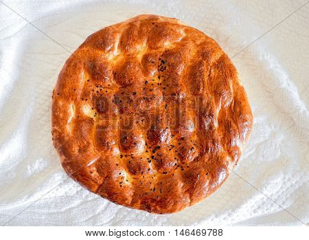 Traditional Turkish Ramadan pita bread on white towel