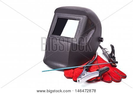 Welding equipment isolated on a white background, welding mask, leather gloves, welding electrodes, high-voltage wires with clips, set of accessories for arc welding