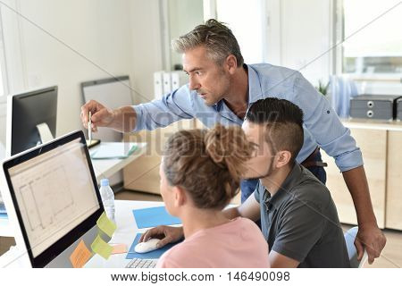 Students in business class with trainer