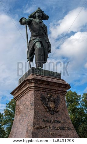 Gatchina, Russia - September 10, 2016: Monument to Russian Emperor Paul I in front of the Gatchina Palace. Paul I - Emperor and Autocrat of all the Russias 1796 - 1801. Behind the monument are the sundial.