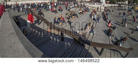 LONDON UK - CIRCA SEPTEMBER 2015: A crowd of people in Trafalgar Square seen with wide angle fish eye lens