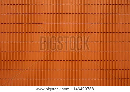 The big wall by the brick with brown color