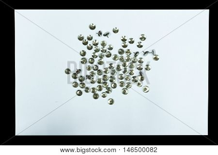 Clear paper and nail is isolated on black background