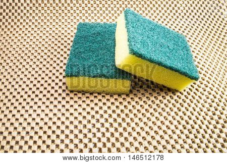 Steel wool dish washer on brown background