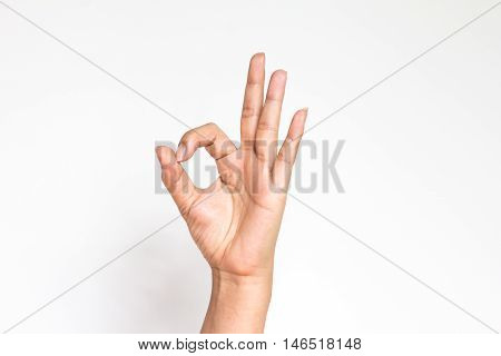 Woman hand in ok sign on a white isolated background