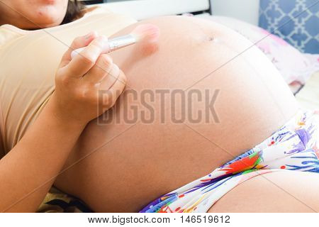 Close Up Pregnant Woman On Bedroom Background