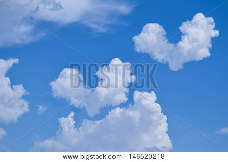 Close Up Blue Sky With Heart Clouds Background