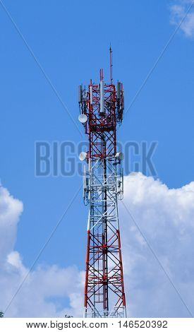 Telecommunication Mast With Microwave Link Antennas Over A Blue Sky.
