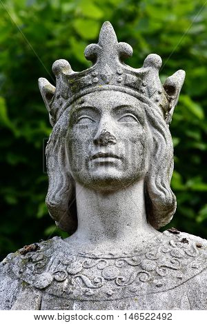 Poissy France - august 6 2016 : the statue of the king Saint Louis near the collegiate church
