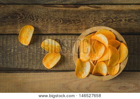 chips in a wooden bowl on the table