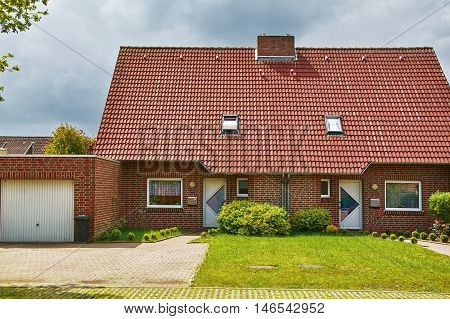 Image of Two-storey Red Brick House with Garage