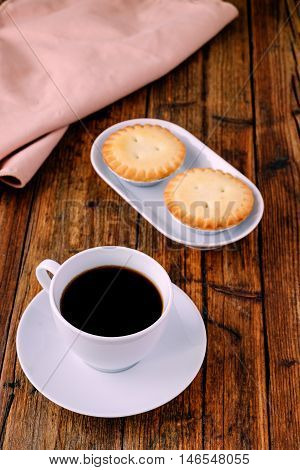 coffee and mince pies for breakfast on a wooden table