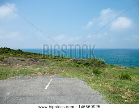 View of Desolated dead end Road Near the Sea