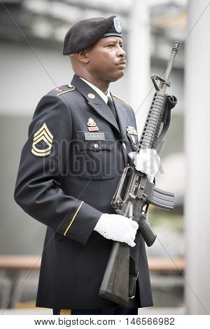NEW YORK MAY 30 2016: Personnel from the US Army 99th Regional Support Command, Fort Dix, NJ prior to the rifle salute at the Memorial Day Observance service on the Intrepid Sea, Air & Space Museum.