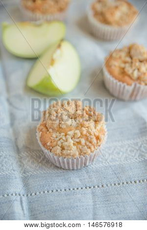 home made apple streusel muffins on a plate