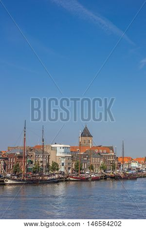 KAMPEN, NETHERLANDS - AUGUST 31, 2016: Sailing boats at the quay in Kampen, The Netherlands