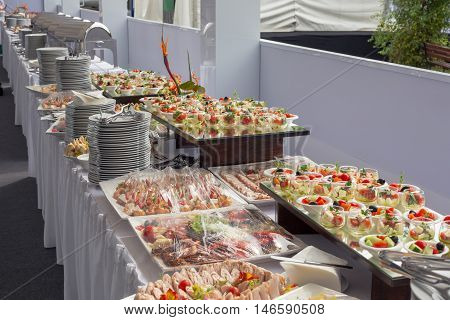 Banquet Table in restaurant served with different meals. Ready for wedding reception.