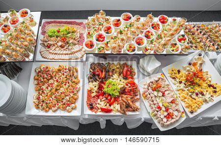 Banquet Table in restaurant served with different meals. Ready for wedding reception.