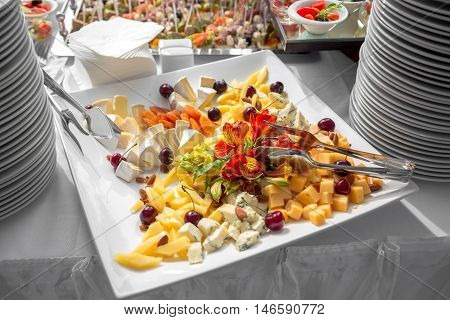 Banquet Table in restaurant served with different meals. Ready for wedding reception.