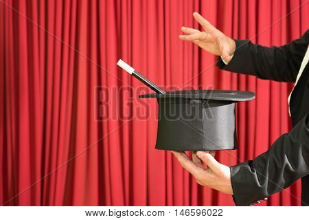 Magician performing on stage, color image, close up