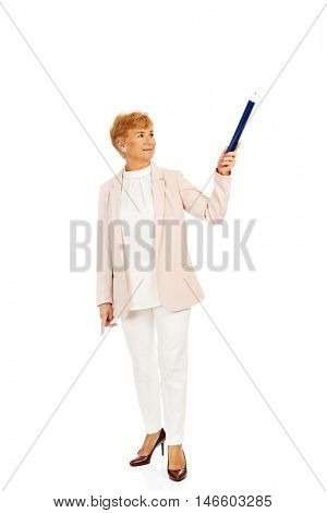 Smile elderly woman pointing up with hege pen