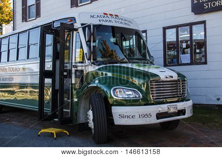 BAR HARBOR, USA - OCTOBER 15, 2015: Bus of the Acadia National Park Bus Tours waiting for passengers the front door of the bus is open