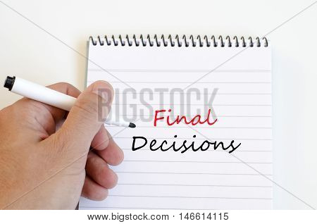 White notepad and human hand on the wooden background