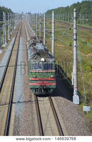 LENINGRAD REGION, RUSSIA - AUGUST 17, 2015: Electric locomotive VL-10 on the double-track section of the railway