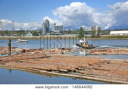 River Industrial Zone, Lumber Industry, Wood - Material Floating On, the tug  boat and yacht are  going along the river.