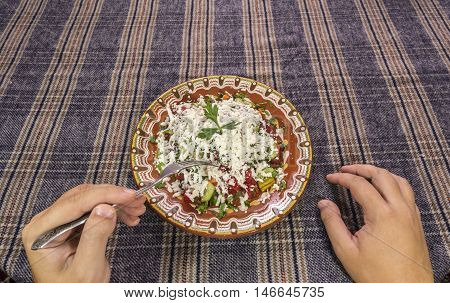 Eating Traditional Shopska Salad