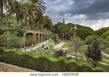BARCELONA SPAIN - JULY 3 2016: Park Guell in Barcelona. Park Guell (1914) is the famous architectural town art designed by Antoni Gaudi.