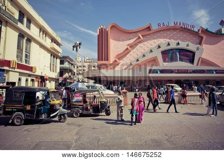 JAIPUR, INDIA - FEB 6, 2015: People going to a famous movie theater Raj Mandir opened in 1976 in Pink City on February 6, 2015. Jaipur with population 6664000 people is a capital of Rajasthan