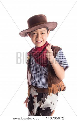 Little boy in cowboy costume on white background