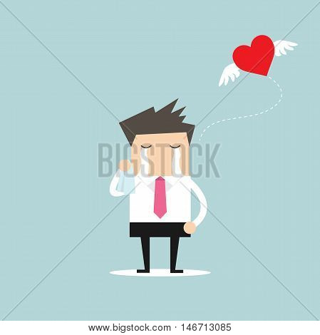Businessman crying broken heart with heart flying away