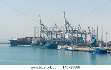 Limassol Cyprus - July 29 2016: Several container ships unloading and loading their cargo at the dock of Limassol harbor in Cyprus