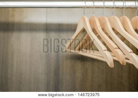 Closeup Clothes hanger in wardrobe. Copy space.