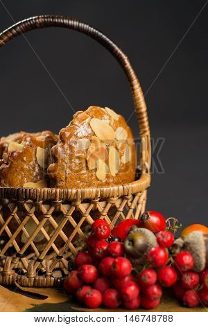 Typical Dutch filled spicy cookies with almonds on autumn colored and dark background