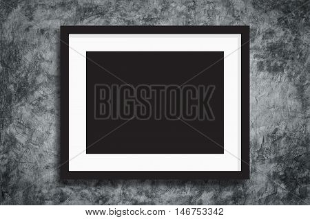 Black photo frame on concreate wall background for design pattern artwork.
