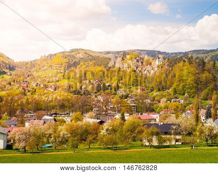 Ruins of Vranov Castle with small rock chapel, aka Pantheon, in Mala Skala on sunny summer day with blue sky and lush green trees, Bohemian Paradise, aka Cesky Raj, Czech Republic