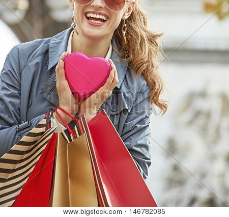 Woman With Shopping Bags Near Arc De Triomphe In Paris, France