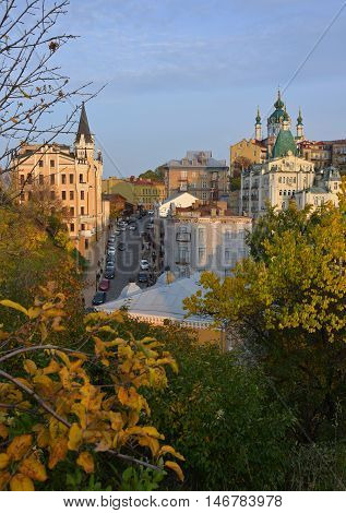 General view of the Andriyivskyy Descent. Autumn yellow trees in foreground.