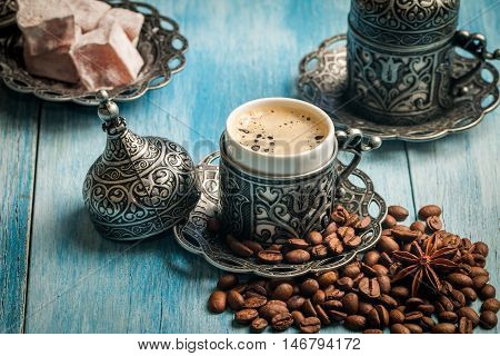 Turkish coffee and turkish delight with traditional embossed metal tray and cup