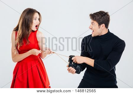 Man theif stealing young woman bag