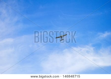 A Small Single-engine Plane In The Sky