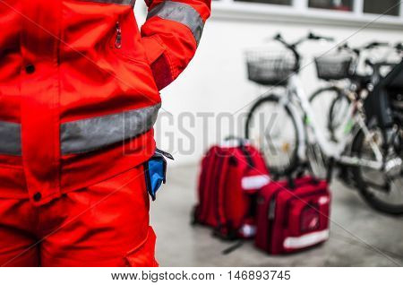 emergency volunteer operator with medical devices and emergency bags