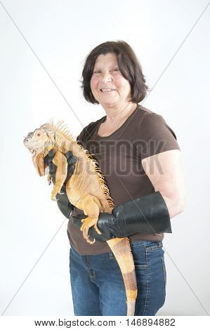Elderly Woman With Iguana On His Hands..