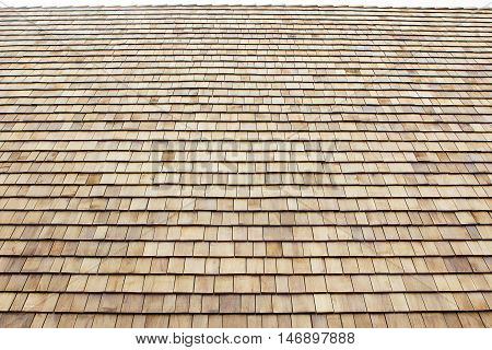 Close up of brown wood roof shingles.Wood background.